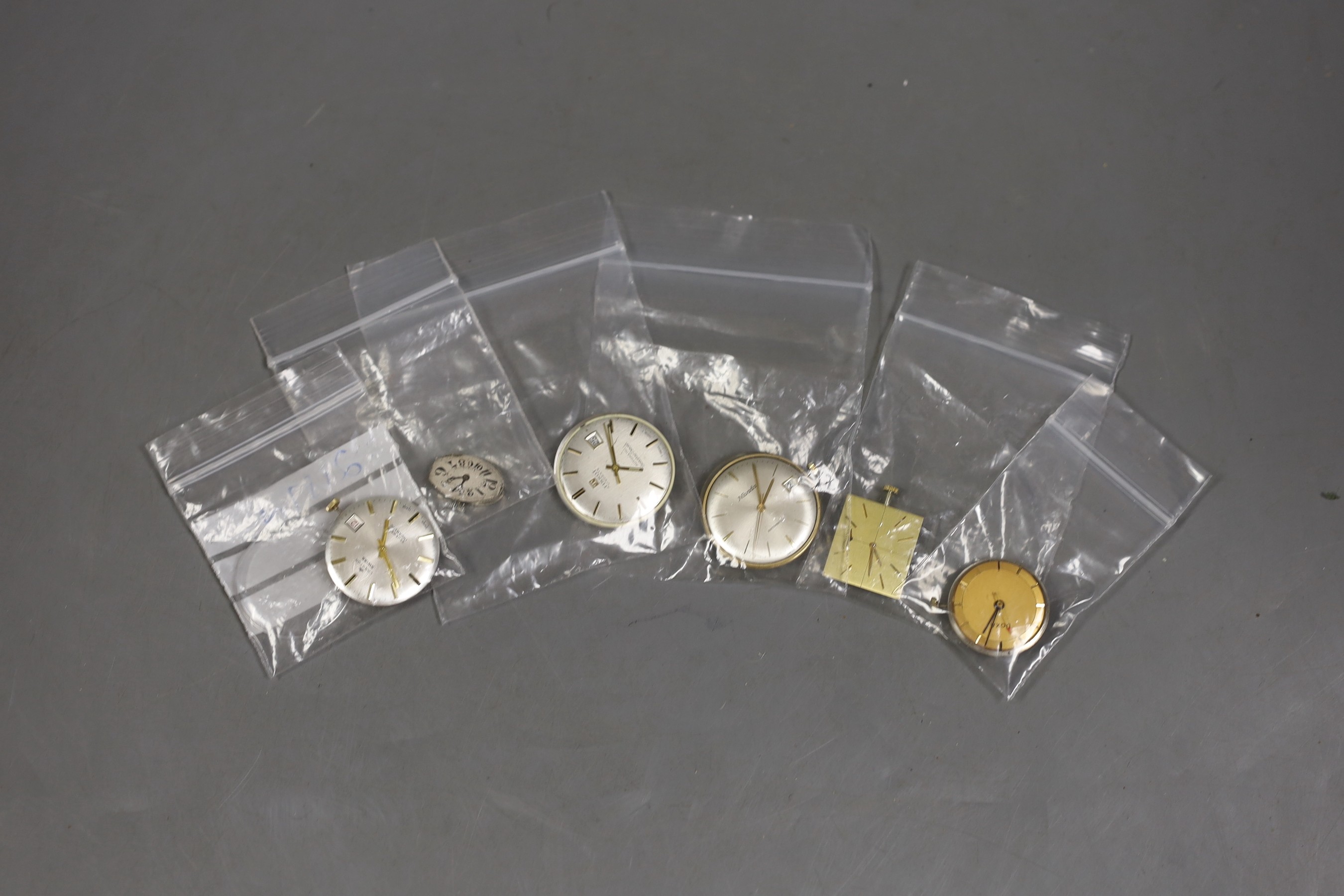 Six assorted wrist watch movements including Longines, Langton, Nivada, Tissot, Doxa and lady's oval dial.
